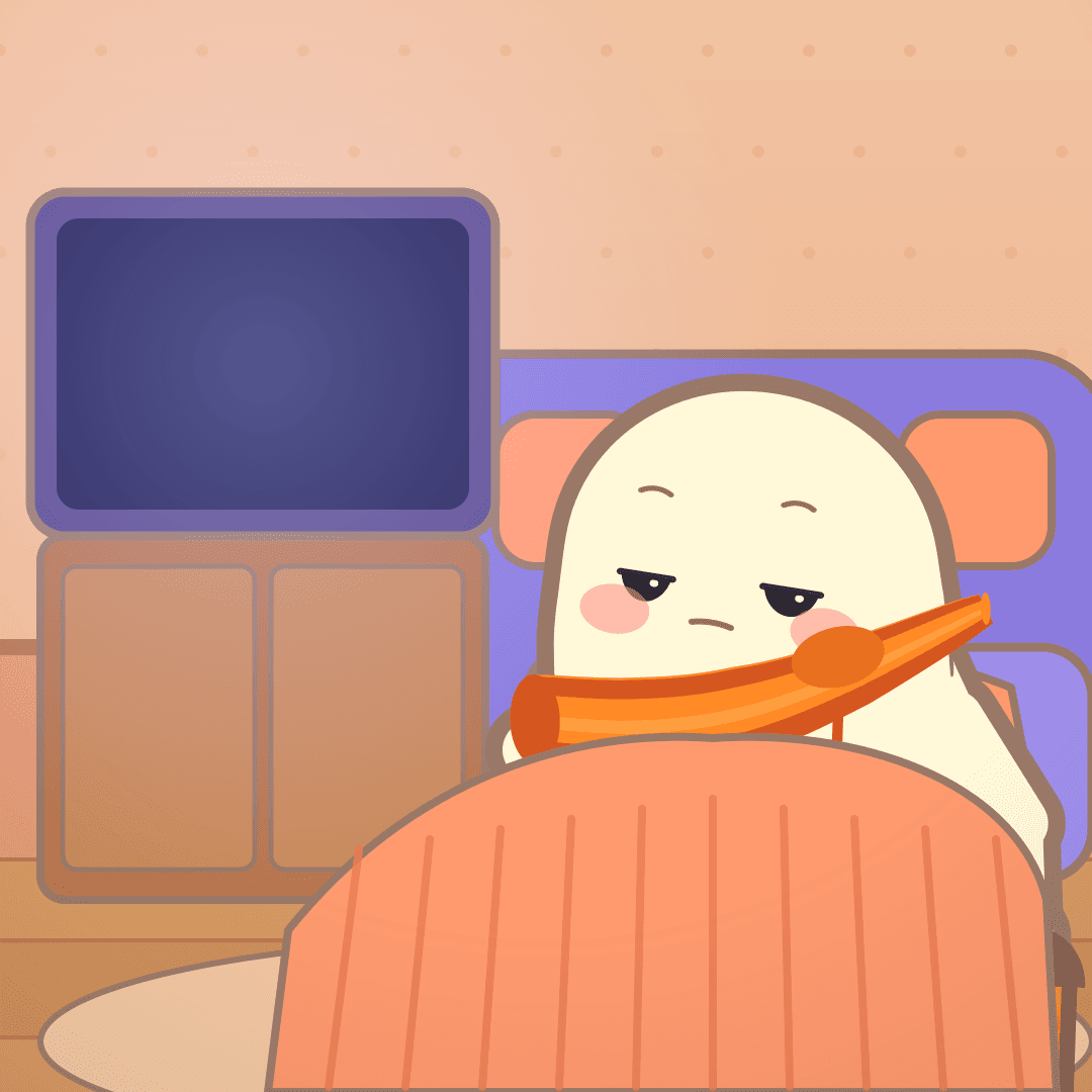 Pip sunk into an orange blanket on the sofa, eyes half shut